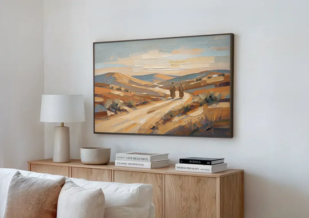 Biblical Wall Art of Two Walking the Judean Road canvas wall art above a wooden sideboard next to a sofa