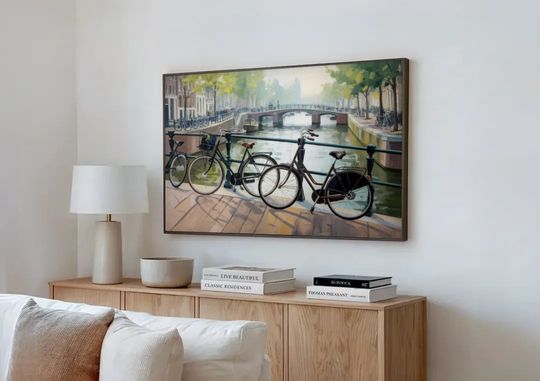 Bicycles of Amsterdam canvas wall art above a wooden sideboard next to a sofa