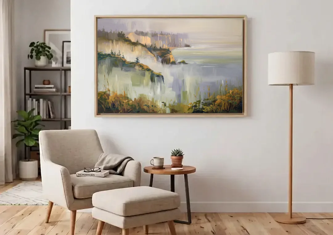 Big Sur Morning Fog canvas wall art above an armchair in a bright living room