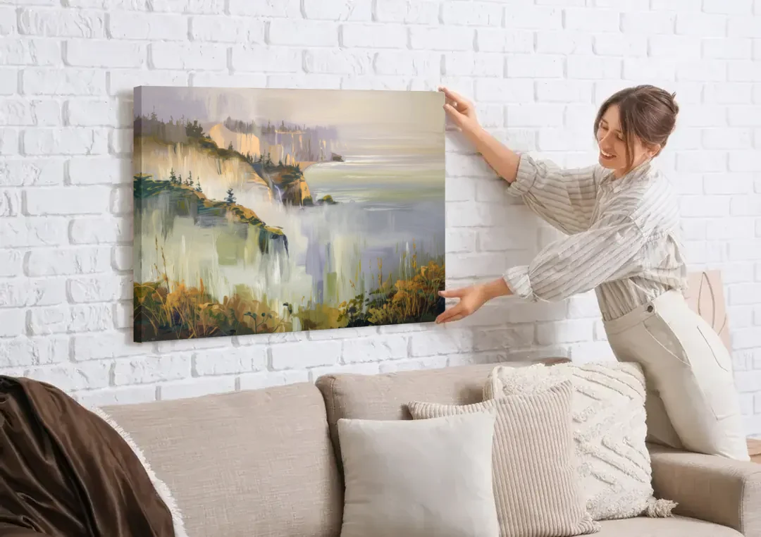 Big Sur Morning Fog canvas wall art being hung on a white brick wall above a sofa