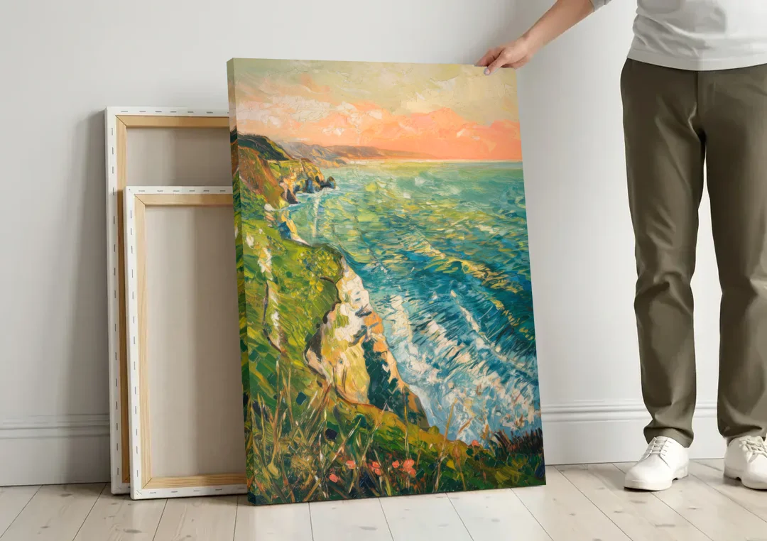 Big Sur Ocean Cliffs canvas wall art leaning against a wall next to blank canvases