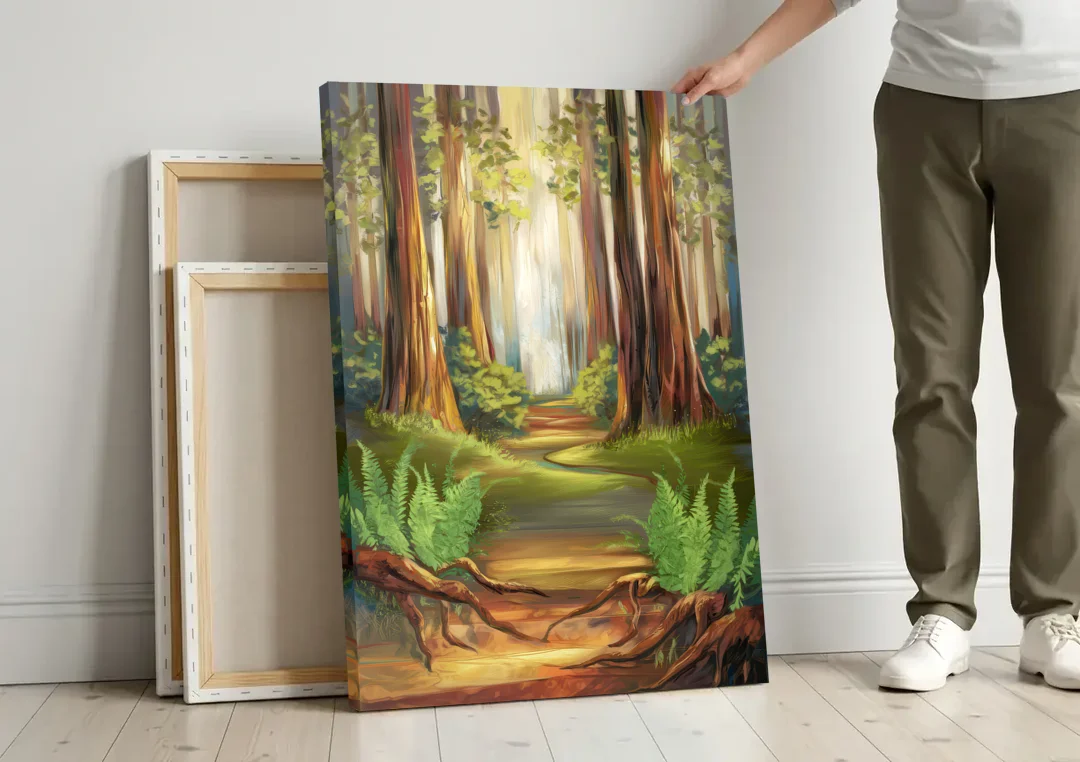 Big Sur Redwood Forest canvas wall art leaning against a wall next to blank canvases