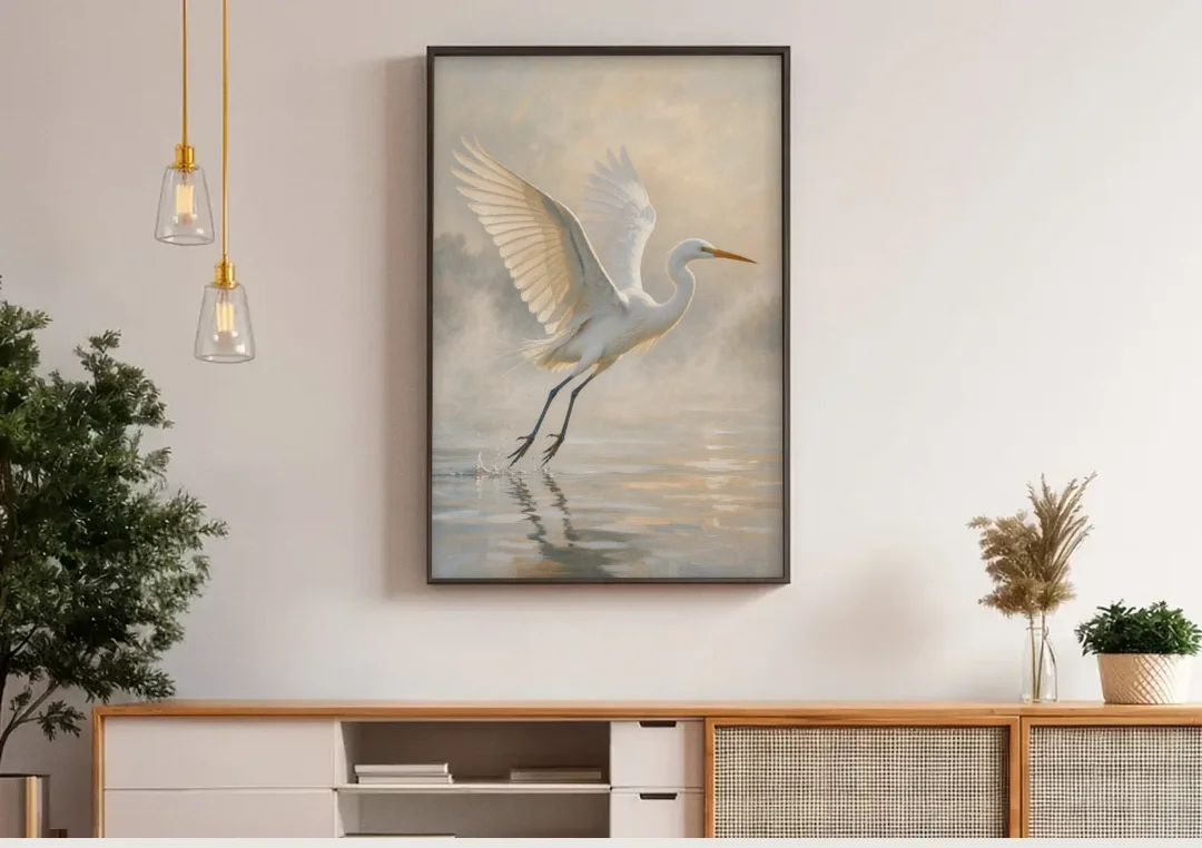 Bird Canvas Wall Art of an Egret Lifting Off canvas wall art above a wooden sideboard under pendant lights