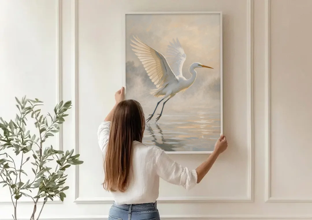 Bird Canvas Wall Art of an Egret Lifting Off canvas wall art being hung on a paneled wall