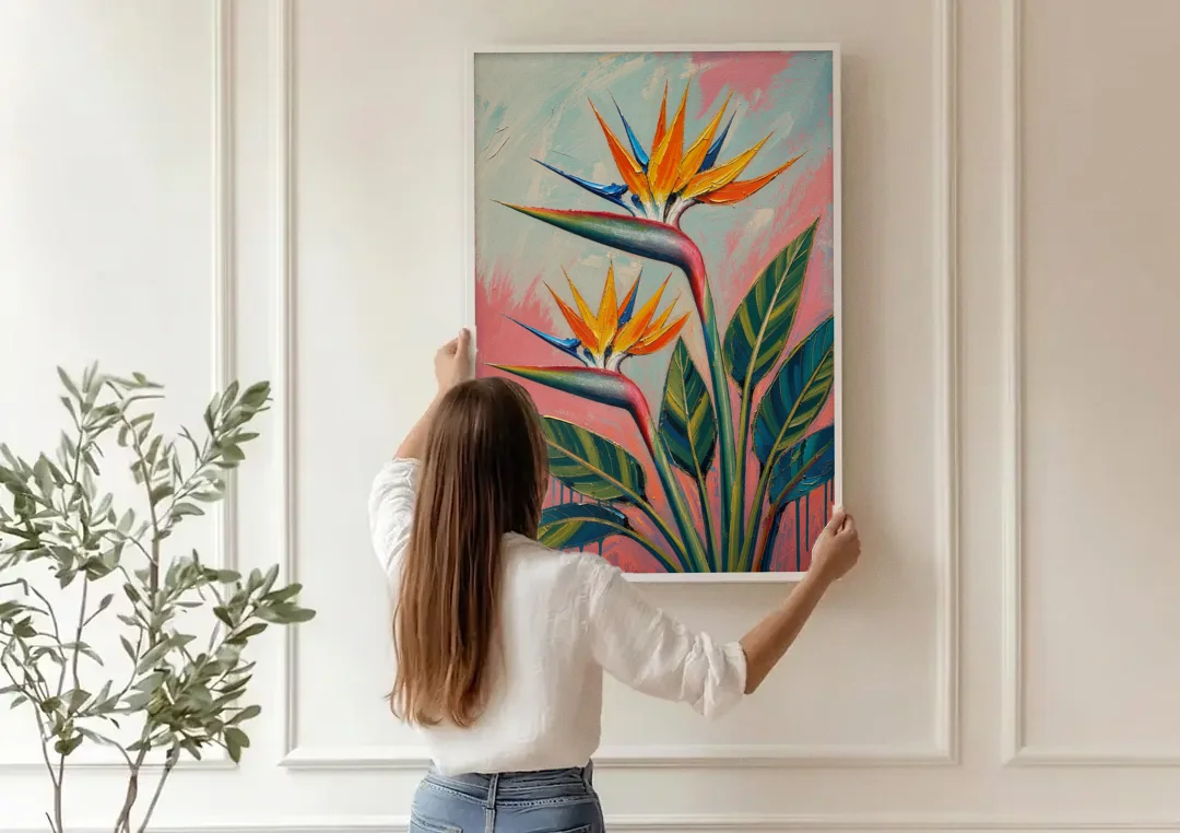 Bird of Paradise Painting in Coral Heat canvas wall art being hung on a paneled wall