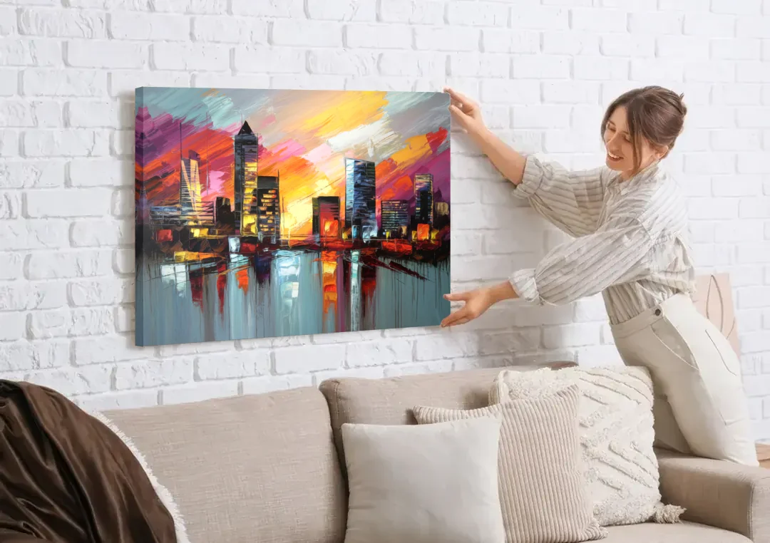 Birmingham Sunset Skyline canvas wall art being hung on a white brick wall above a sofa