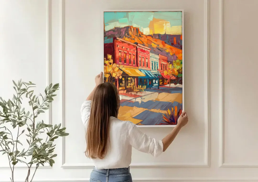 Bisbee Quaint Downtown View canvas wall art being hung on a paneled wall
