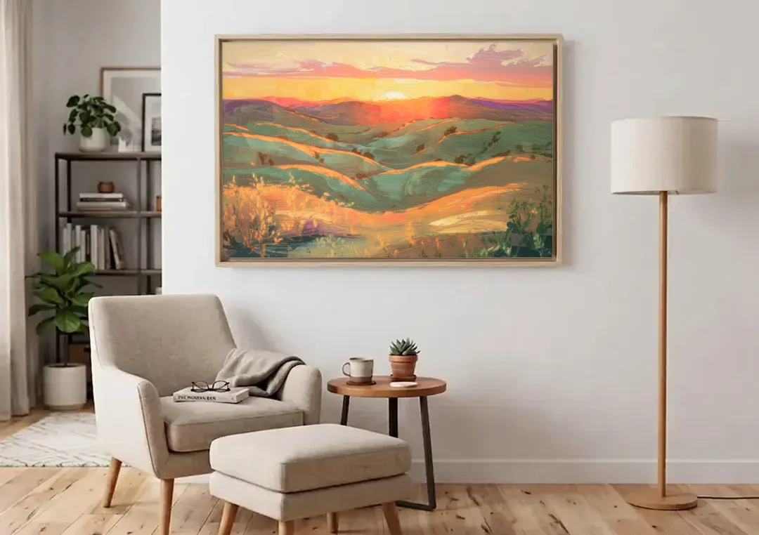 Bisbee Sunset Over Hills canvas wall art above an armchair in a bright living room