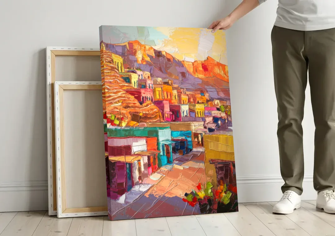 Bisbee Vibrant Skyline canvas wall art leaning against a wall next to blank canvases