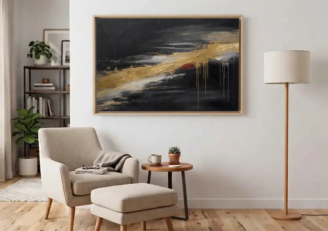 Black and Gold Abstract with Crimson Ember for Dining Rooms canvas wall art above an armchair in a bright living room