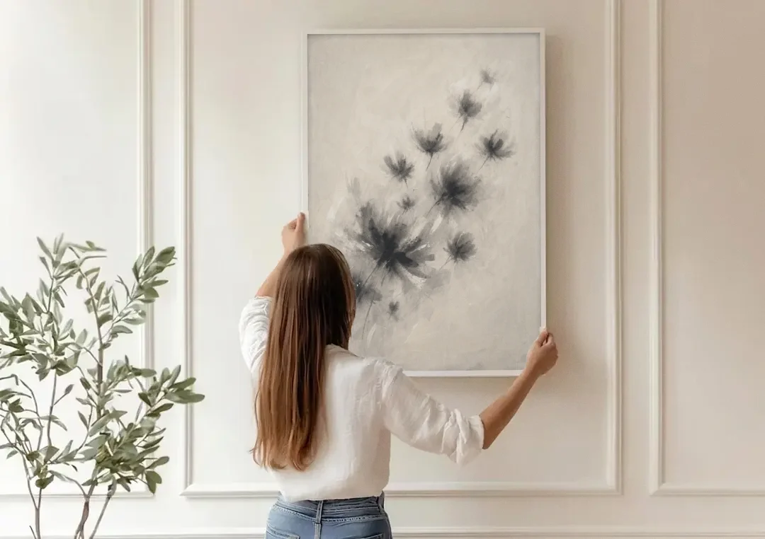 Black and White Abstract Art Prints Charcoal Blooms canvas wall art being hung on a paneled wall
