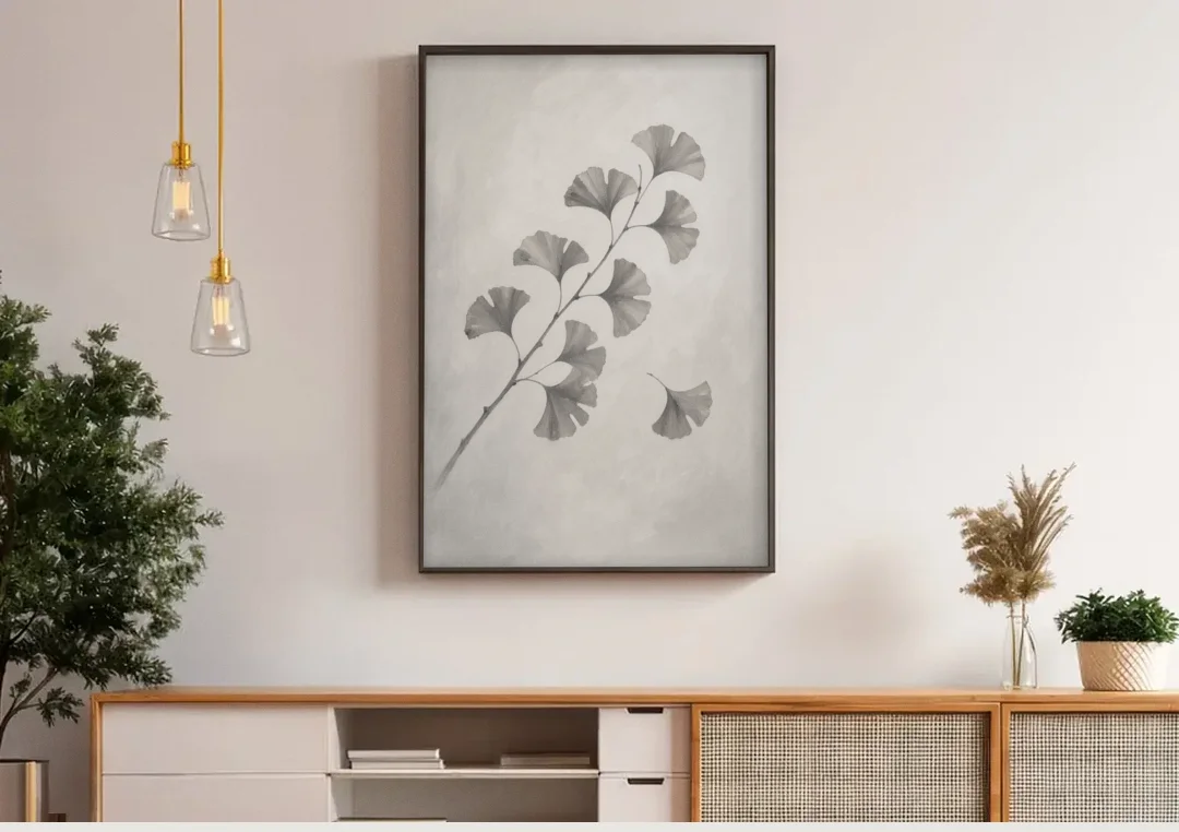 Black and White Bedroom Decor With a Ginkgo Sprig canvas wall art above a wooden sideboard under pendant lights