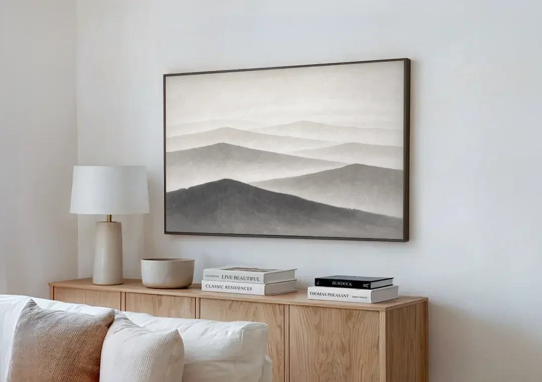 Black and White Bedroom Wall Art of Misty Ridges canvas wall art above a wooden sideboard next to a sofa