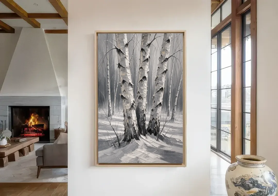 Winter Black and White Birch Trio in Deep Snow canvas wall art in a living room with a fireplace
