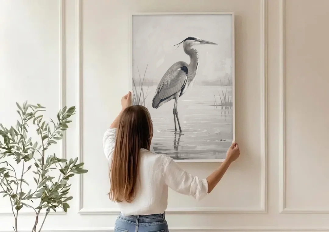 Black and White Bird Painting of a Marsh Heron canvas wall art being hung on a paneled wall