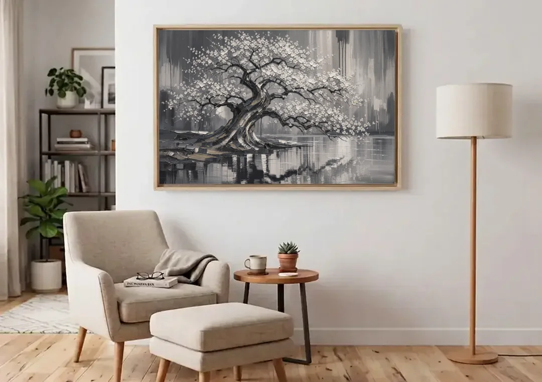 Black and White Cherry Blossom Over a Still Pond canvas wall art above an armchair in a bright living room