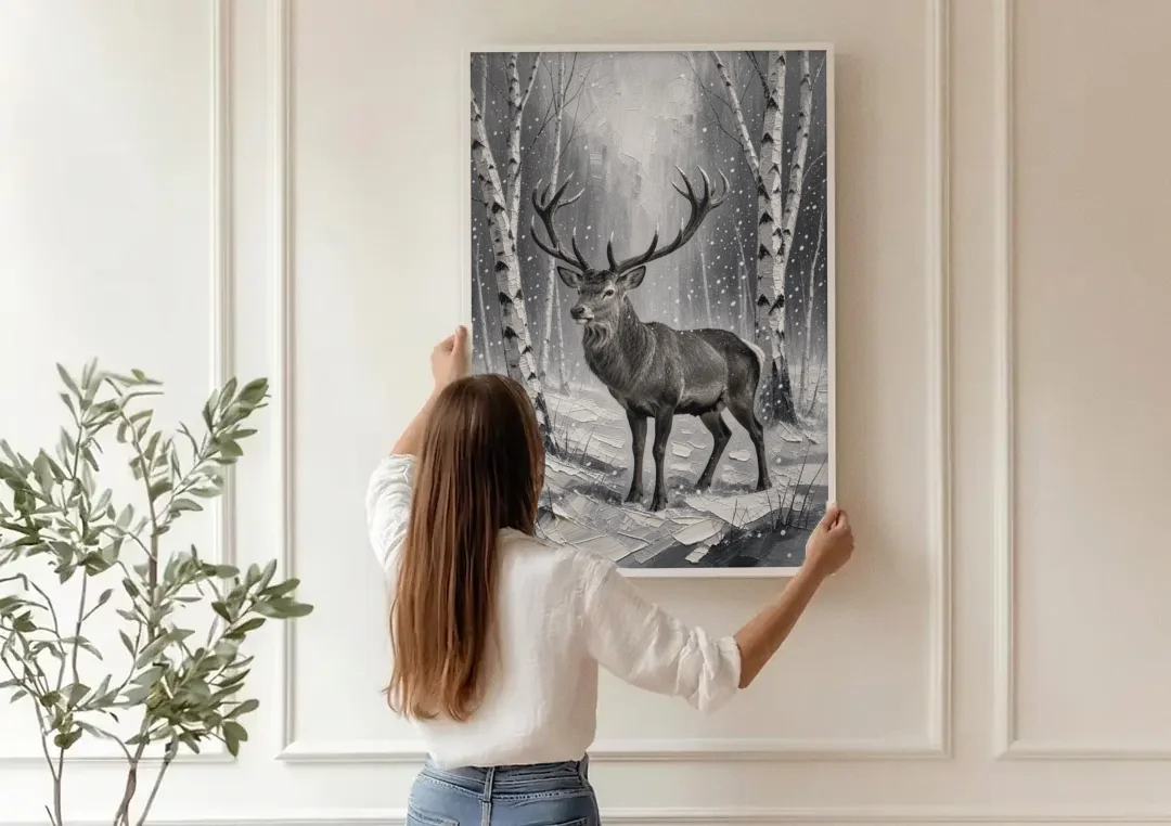 Black and White Forest Canvas with Stag canvas wall art being hung on a paneled wall