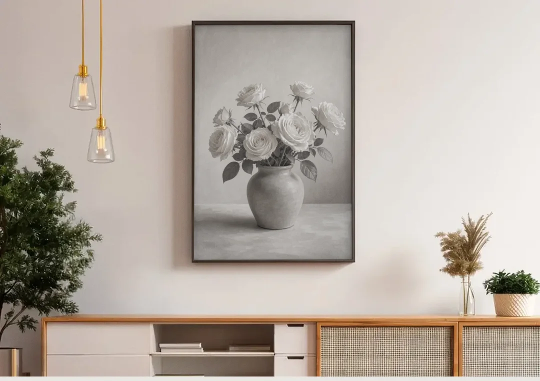 Black and White Garden Roses in a Stone Vase canvas wall art above a wooden sideboard under pendant lights