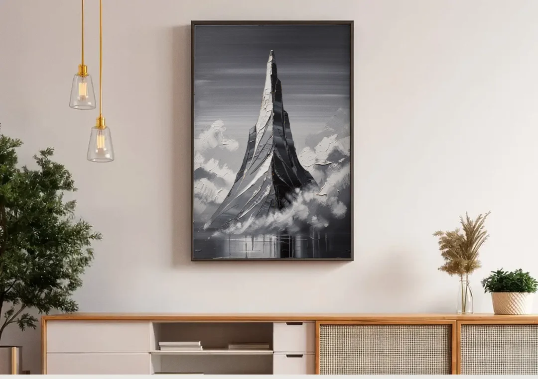 Black and White Granite Mountain Spire canvas wall art above a wooden sideboard under pendant lights