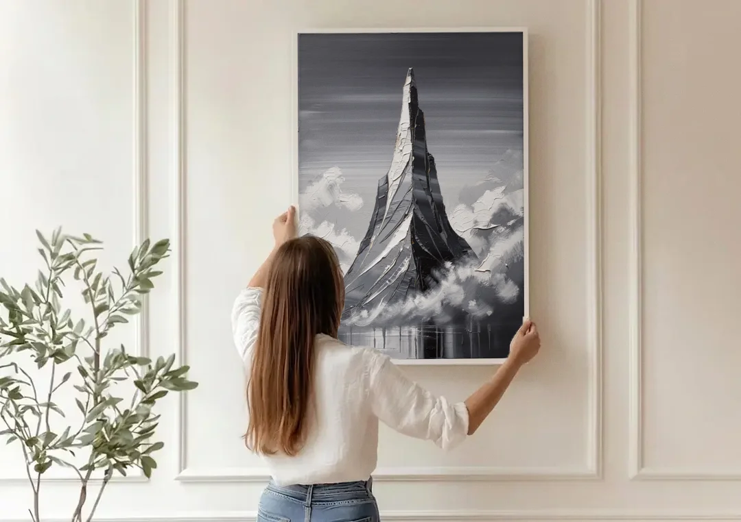 Black and White Granite Mountain Spire canvas wall art being hung on a paneled wall