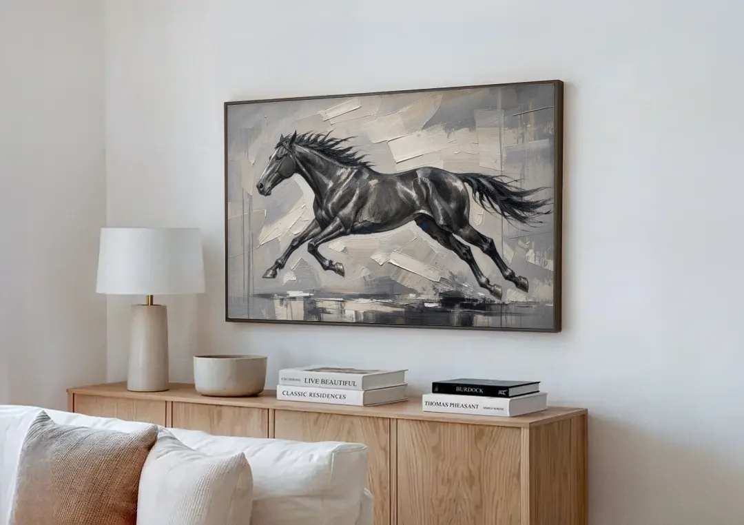Black and White Horse Painting in Full Stride canvas wall art above a wooden sideboard next to a sofa