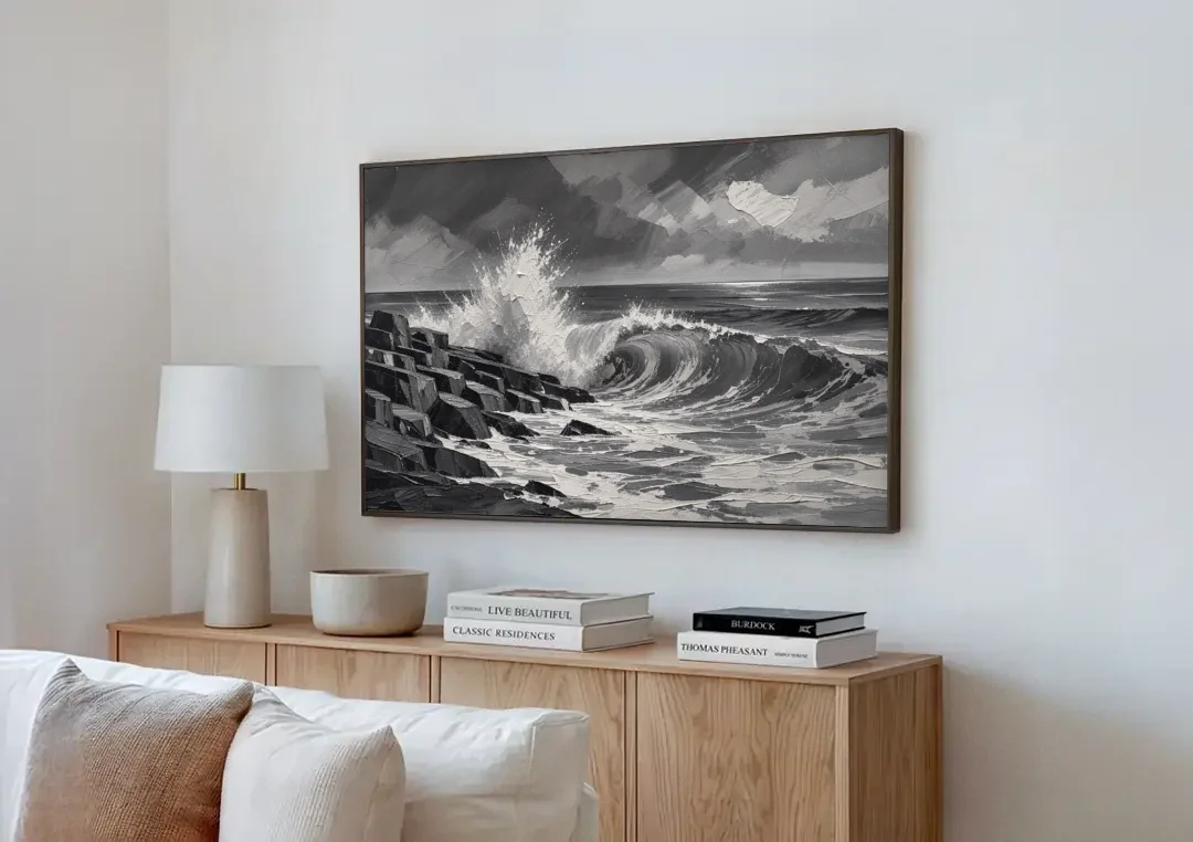 Black and White Paintings of a Crashing Wave canvas wall art above a wooden sideboard next to a sofa