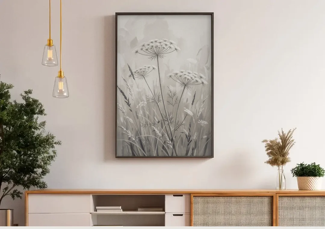 Black and White Queen Anne's Lace Flower Meadow canvas wall art above a wooden sideboard under pendant lights