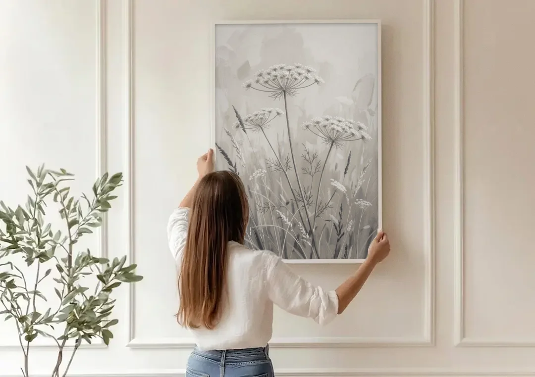 Black and White Queen Anne's Lace Flower Meadow canvas wall art being hung on a paneled wall