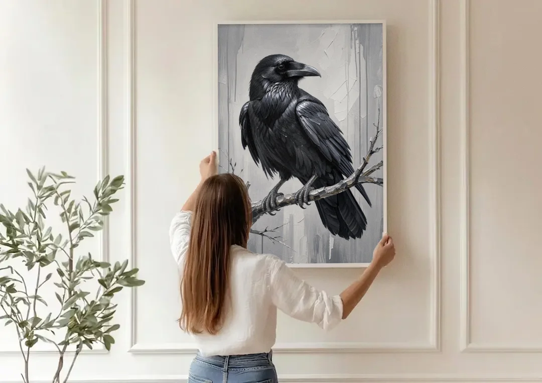 Black and White Raven on a Gnarled Branch canvas wall art being hung on a paneled wall