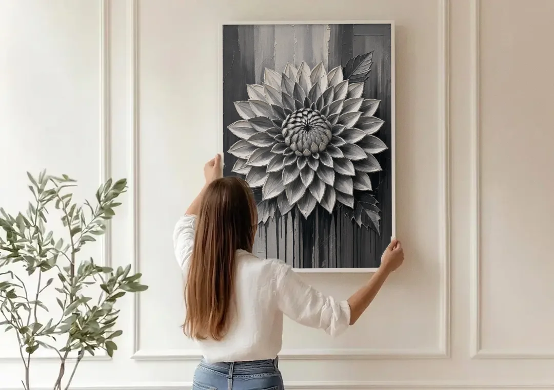 Black and White Textured Wall Art of a Dahlia canvas wall art being hung on a paneled wall