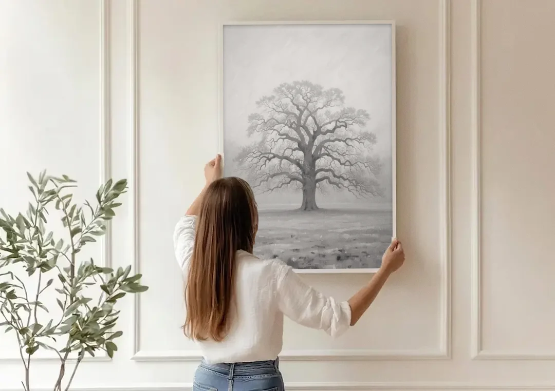 Black and White Tree Painting in Fog canvas wall art being hung on a paneled wall