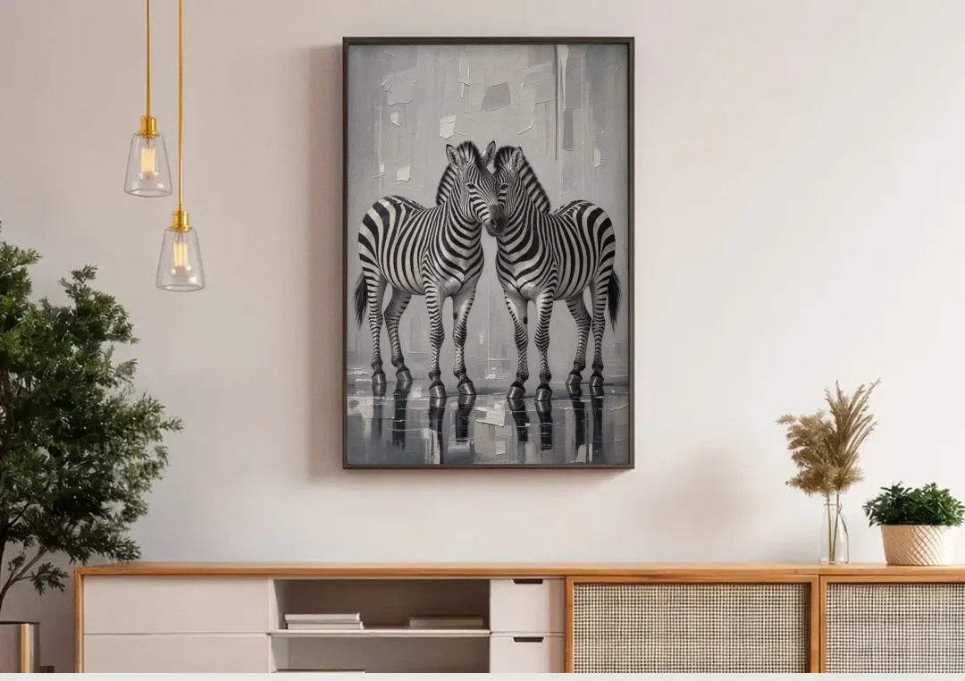 Black and White Zebra Grooming Pair in Palette Knife canvas wall art above a wooden sideboard under pendant lights