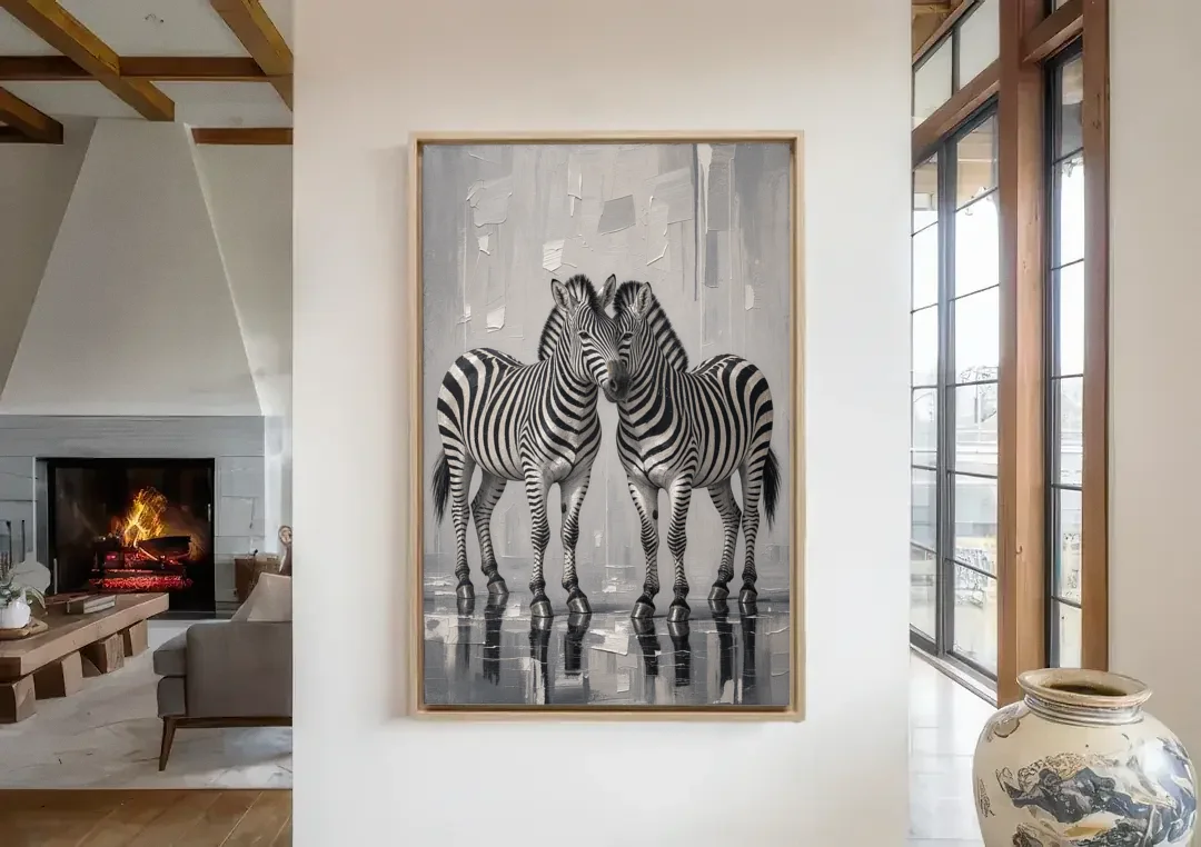 Black and White Zebra Grooming Pair in Palette Knife canvas wall art in a living room with a fireplace
