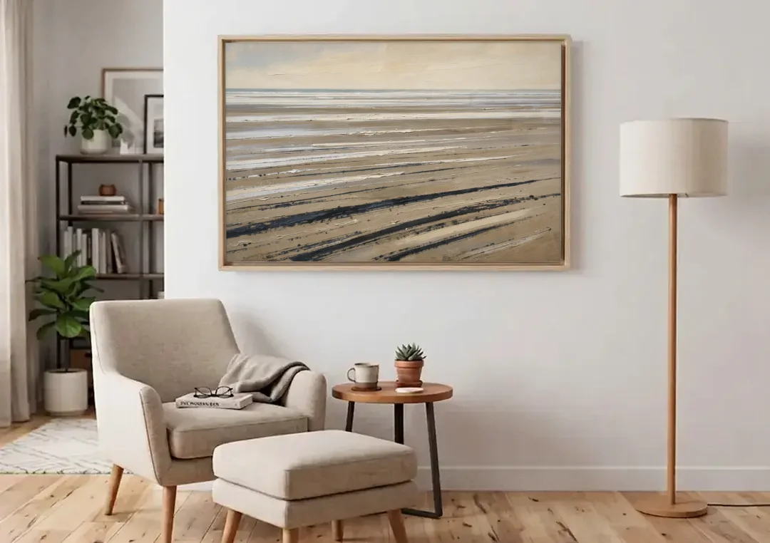 Black Brush Stroke Painting of Low Tide Sand canvas wall art above an armchair in a bright living room