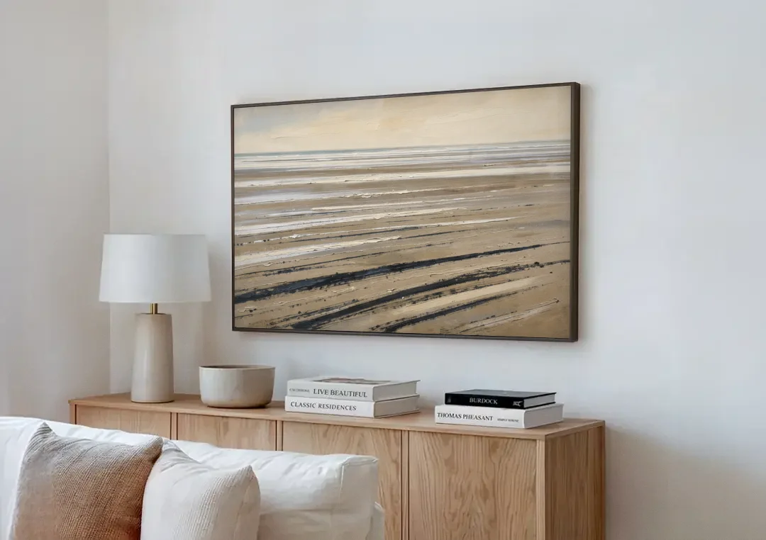 Black Brush Stroke Painting of Low Tide Sand canvas wall art above a wooden sideboard next to a sofa