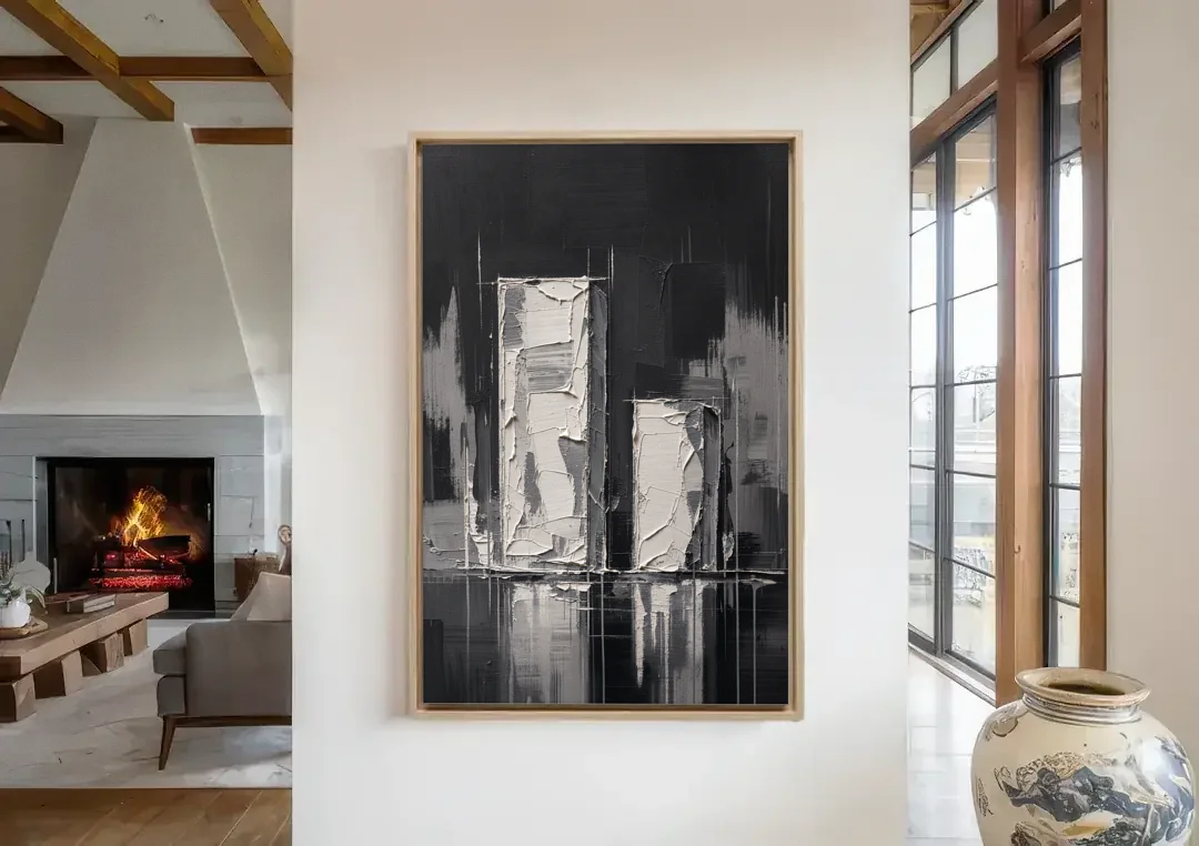 Black Minimalist Wall Art of Tall and Short Blocks canvas wall art in a living room with a fireplace