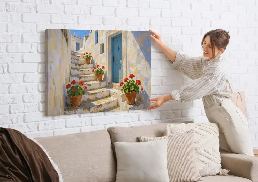 Blue and White Wall Art with Geranium Steps canvas wall art being hung on a white brick wall above a sofa