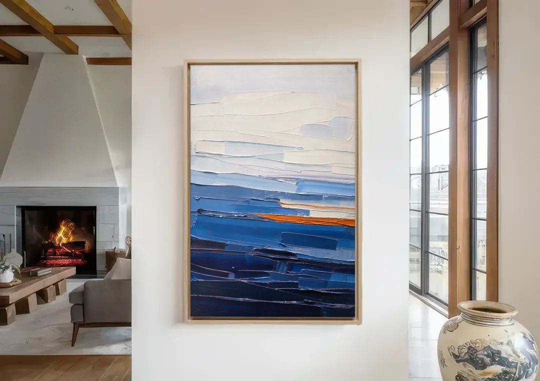 Blue Triptych Wall Art Strata I with Ember Seam canvas wall art in a living room with a fireplace