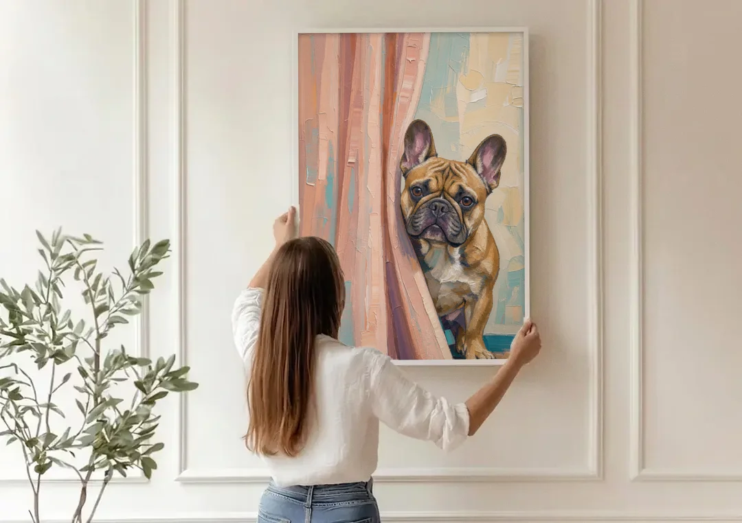 Blush Pink Bathroom Art with a Peeking French Bulldog canvas wall art being hung on a paneled wall