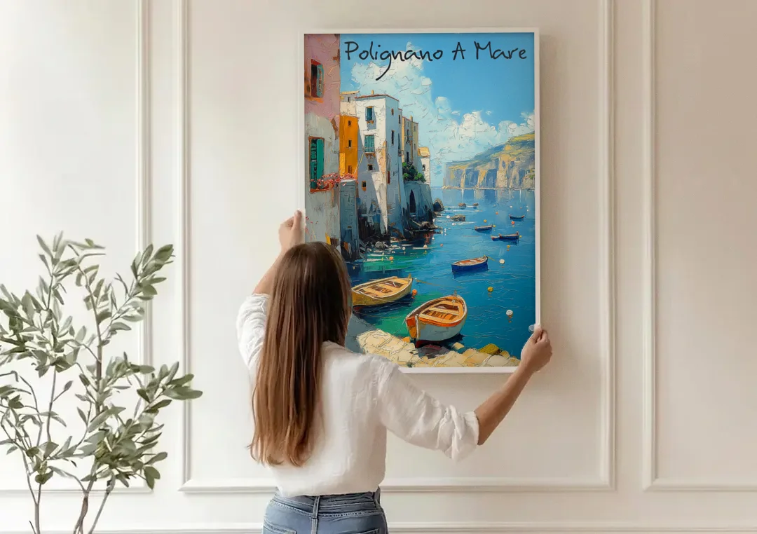 Boats Painting of Polignano a Mare canvas wall art being hung on a paneled wall