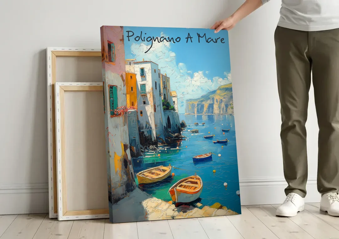 Boats Painting of Polignano a Mare canvas wall art leaning against a wall next to blank canvases