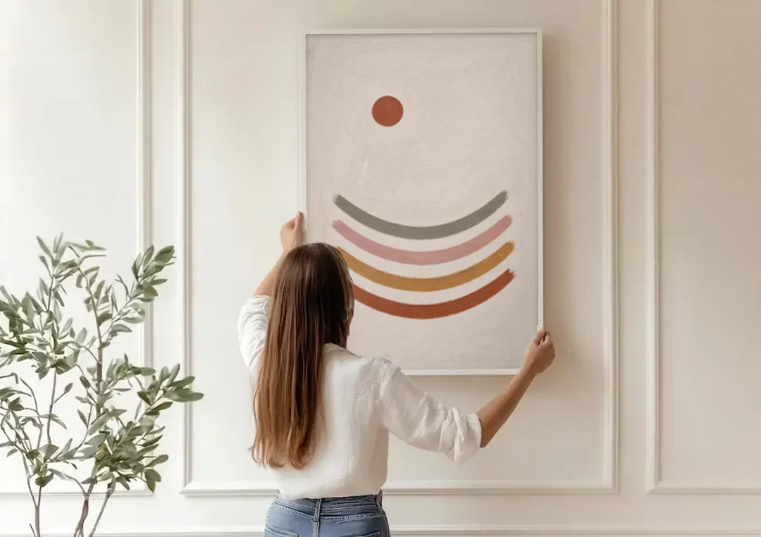 Boho Abstract Art with Clay Sun and Ripples canvas wall art being hung on a paneled wall