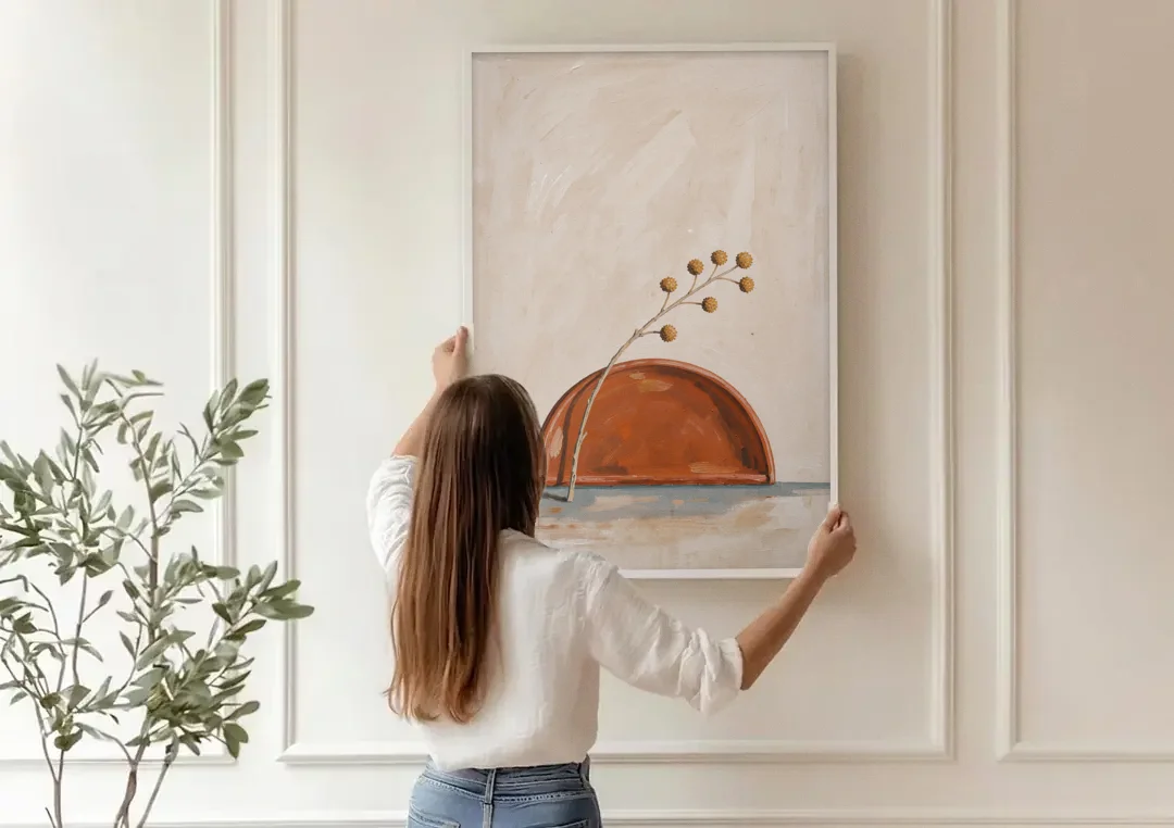Boho Abstract Wall Art of a Rising Terracotta Dome canvas wall art being hung on a paneled wall
