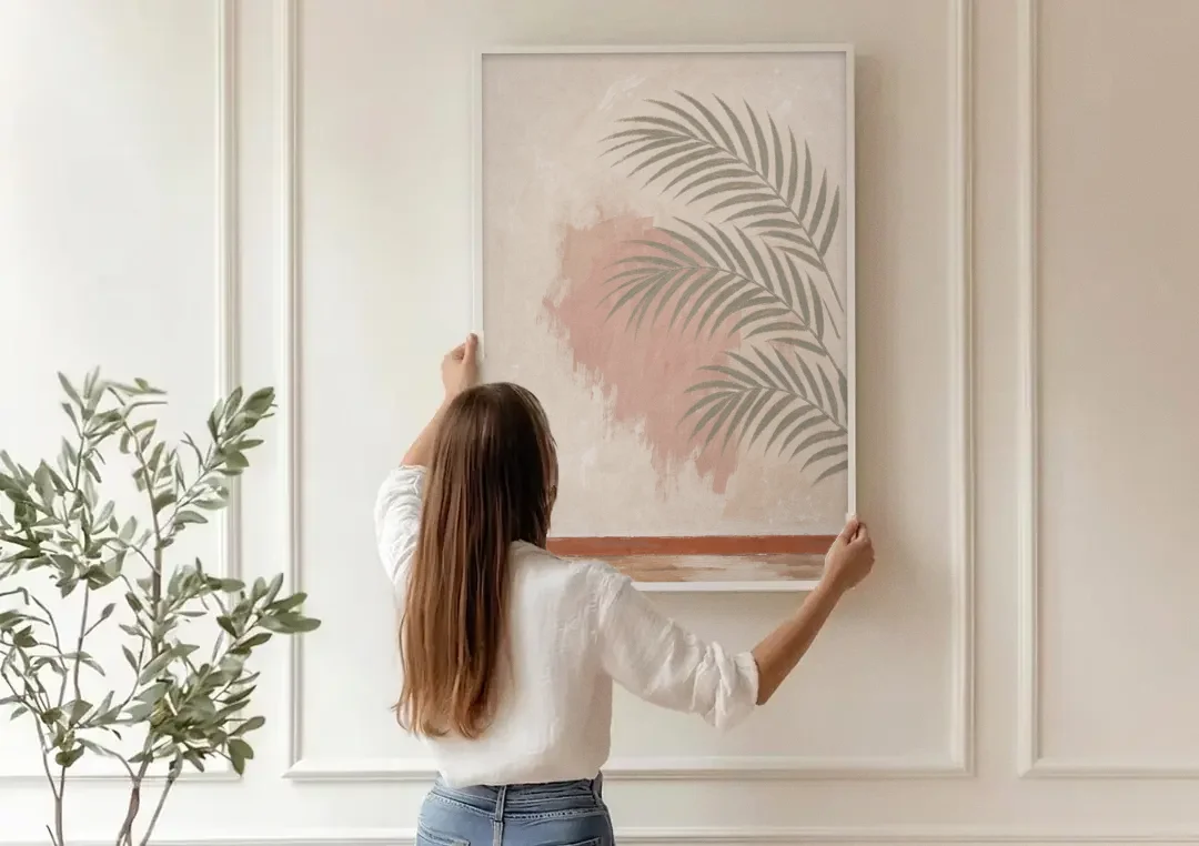 Boho Bathroom Wall Art with Palm Leaf Shadow canvas wall art being hung on a paneled wall