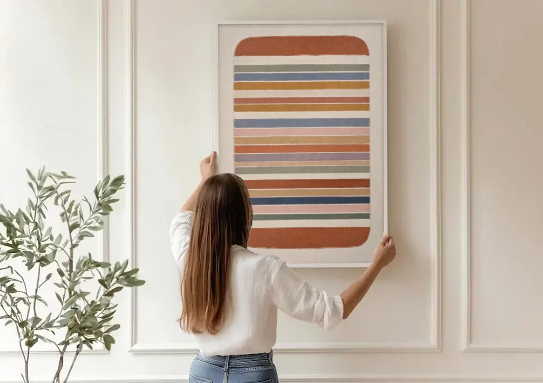 Boho Canvas Prints of Woven Blanket Stripes canvas wall art being hung on a paneled wall