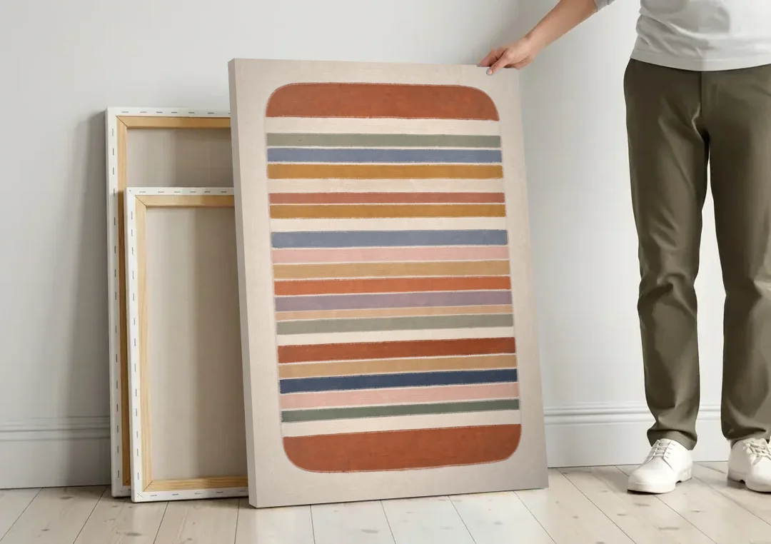 Boho Canvas Prints of Woven Blanket Stripes canvas wall art leaning against a wall next to blank canvases