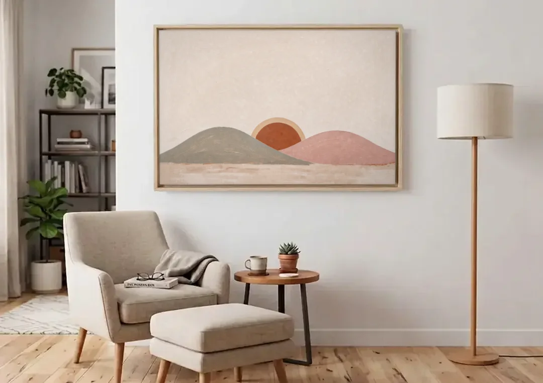 Boho Landscape Painting with Sun Between Hills canvas wall art above an armchair in a bright living room