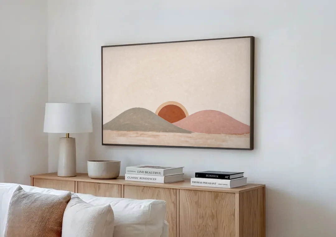 Boho Landscape Painting with Sun Between Hills canvas wall art above a wooden sideboard next to a sofa