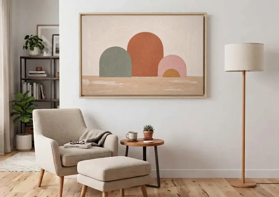 Boho Living Room Wall Art with Three Painted Arches canvas wall art above an armchair in a bright living room