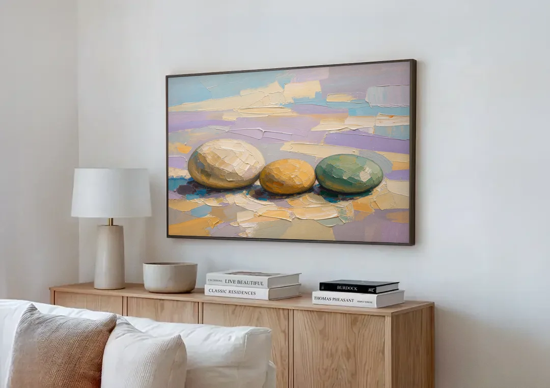 Boho Neutral Pebble Trio in Ivory, Ochre and Sage canvas wall art above a wooden sideboard next to a sofa